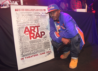 Rapper Rakim poses with the movie poster. (WireImage)